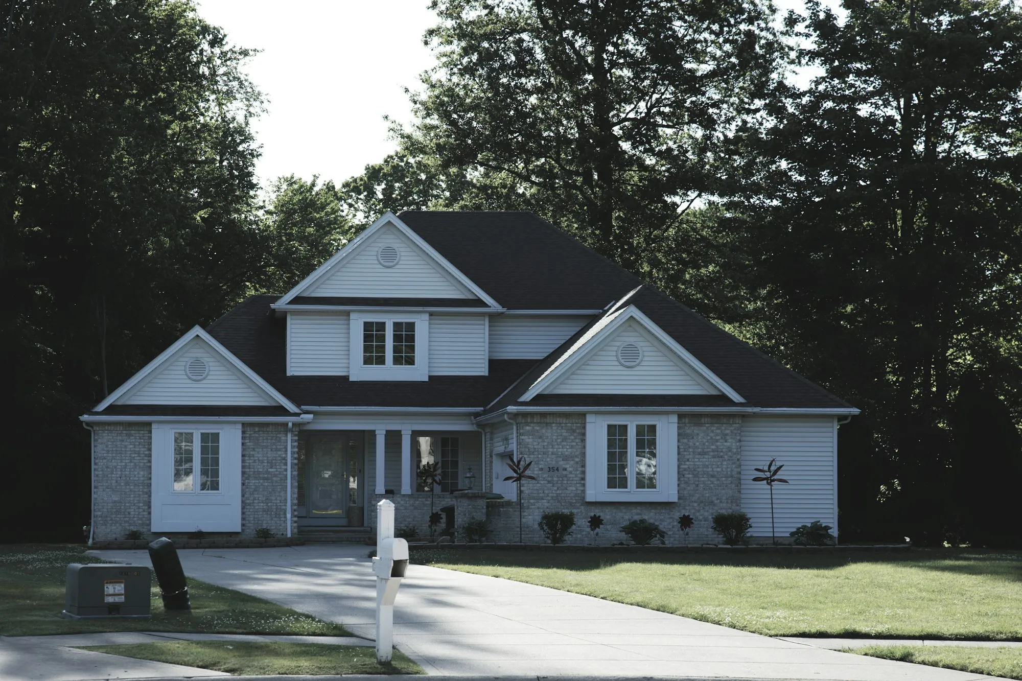 Suburban house with a newly finished dark roof