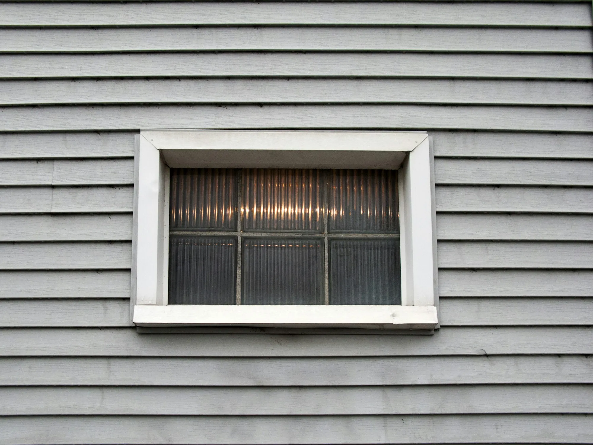 Window set into horizontal lap siding